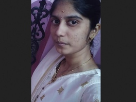 College student Bhabi shows off her big breasts in a revealing outfit