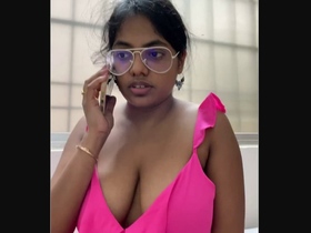 Curvy office girl flaunts her big boobs in a revealing outfit
