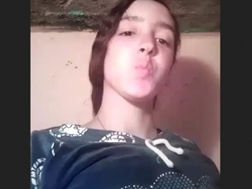 A cute Indian girl flaunts her small breasts and intimate area in a video