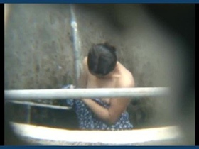 Caught neighborhood girl gets naughty in the outdoor shower