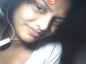 Watch a young Indian girl flaunt her big breasts and tight vagina