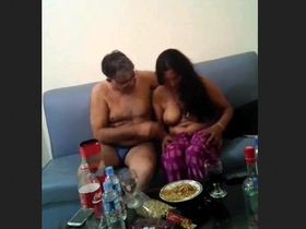 Randi and an older man enjoy some steamy action in a video