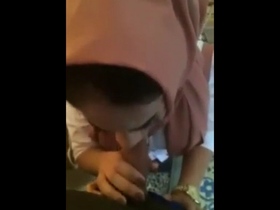 Arab babe in hijab gives a sensual blowjob to her lover