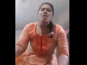 Unsatisfied wife shows her breasts to her husband in a village setting