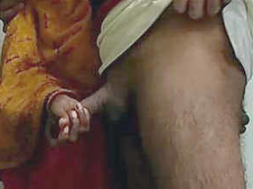 Indian maid gives a handjob and gets a cumshot
