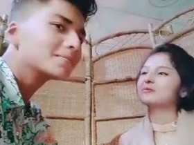 Cute couple enjoys romantic outdoor kissing in restaurant