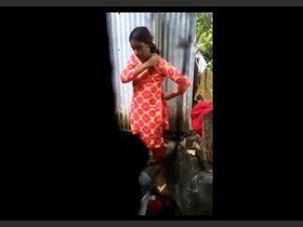 A young Asian girl gets naughty in the shower under the sun